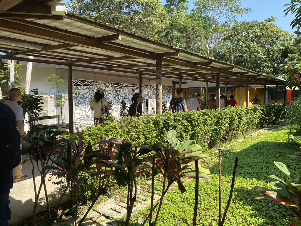 Colorful buildings and murals on UNAL's Leticia campus, Sept 2023