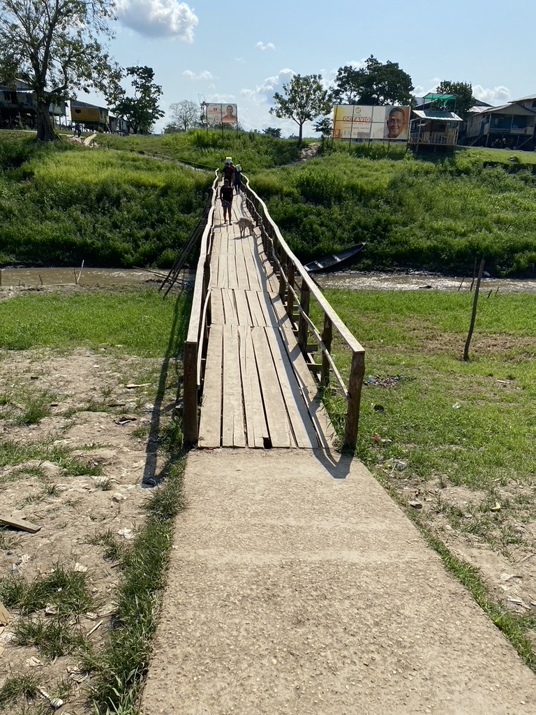 Bridge with roaming dog on walk to boat launch, Sept 2023