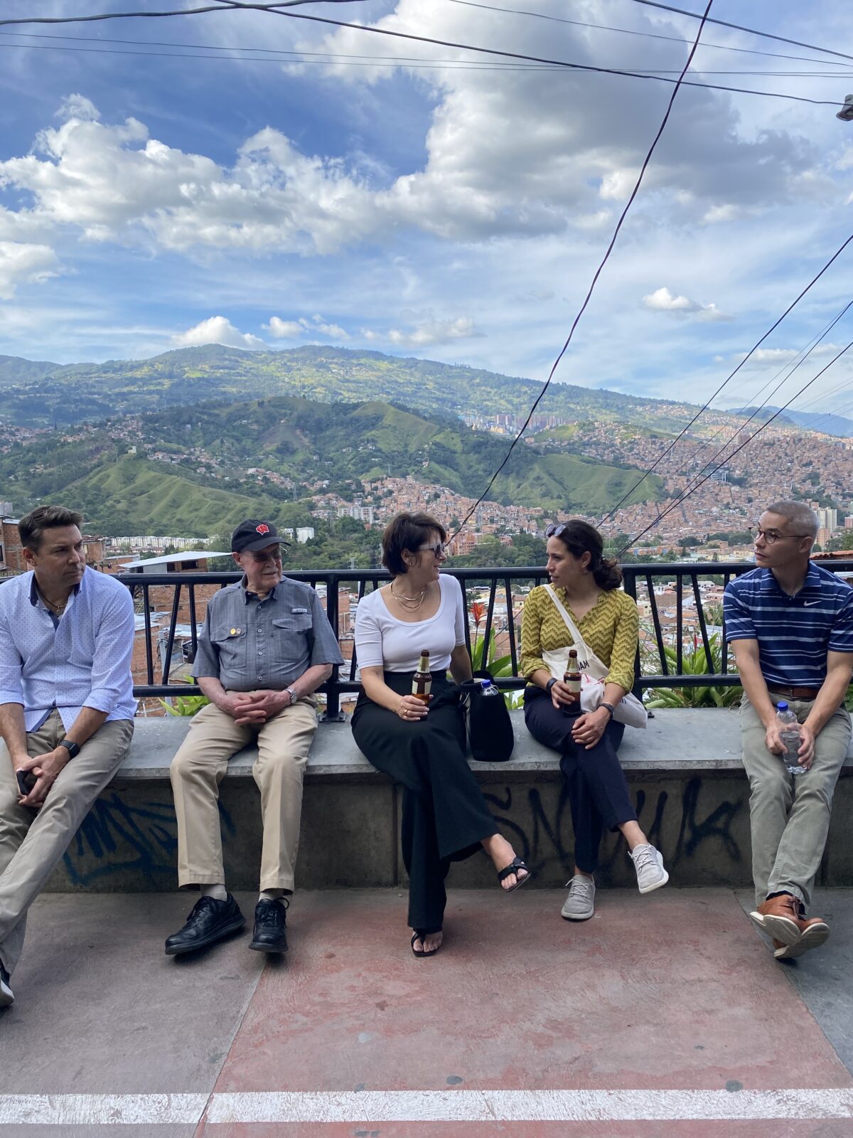 Janis Tupesis, Tom Yuill, Lora Klenke, Elsa Cardena Canales, John Chan take a break in Comuna 13, Sept 2023