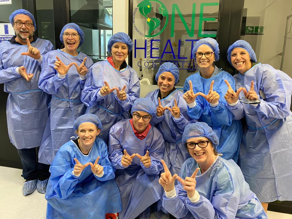 Calyn Ostrowski and GHI/UW–Madison delegates touring GHI One Health Center-Colombia's BSL-2 lab and viewing state-of-the-art equipment from industry partners, like Abbott Labs (photo courtesy GHI)