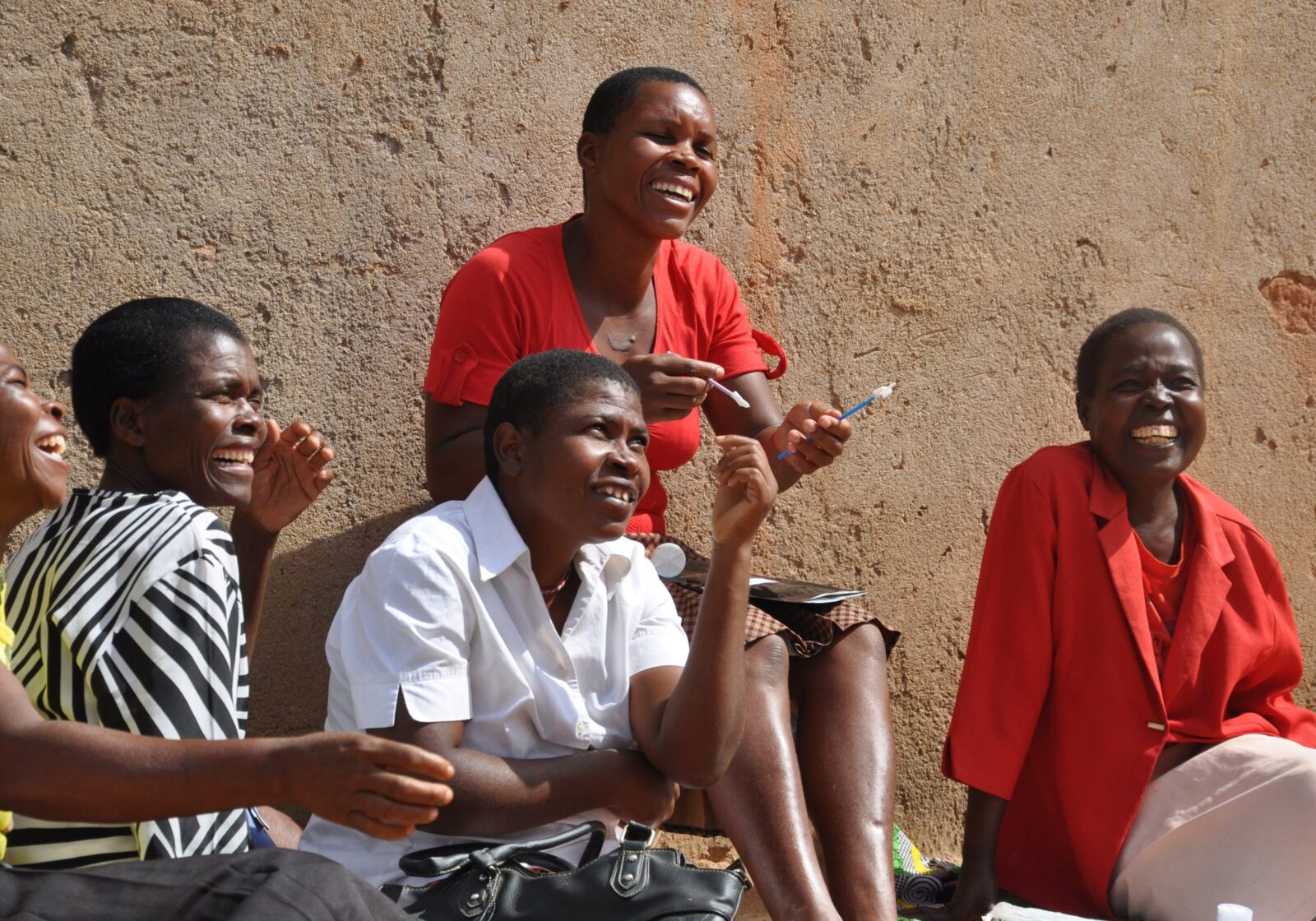 May 2022 five women sitting together and laughing