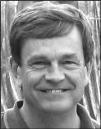 black and white photo of a man smiling