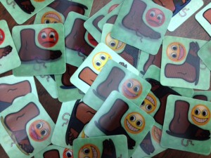 These images, glued to sandals for the Holoflop project change from smiling to frowning, showing the benefits of wearing sandals to avoid diseases spread by worms found in the soil.