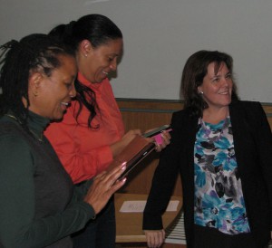 From left, QI participants XXXXXXXX and XXXXXXX visit with QI Director Lori DiPrete Brown.