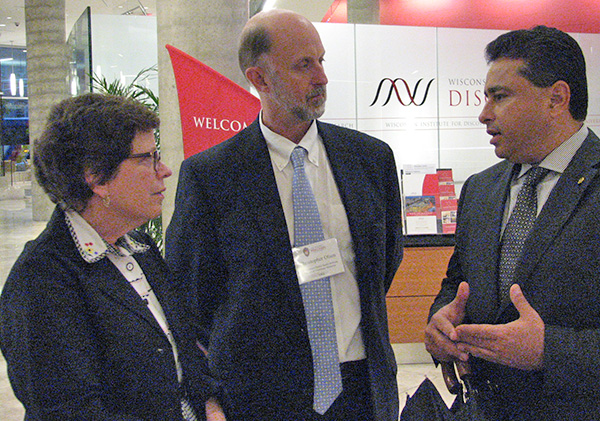 Then GHI Acting Director Christopher Olsen, center, joins Chancellor Rebecca Blank for a pre-World Dairy Expo event.