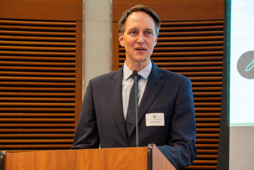 Photo from 2026 Global Health Symposium at the Discovery Building; Dr Westergaard at lecturn